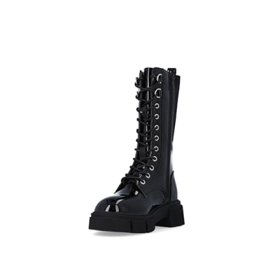 360 degree animation of product Girls Black Knee High CHUNKY Lace Up Boots frame-23