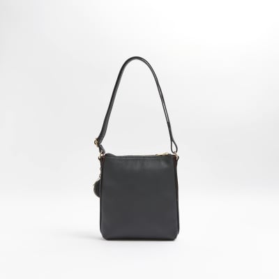 Girls black patent RI embossed messenger bag River Island