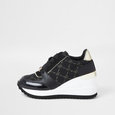 girls black and gold trainers