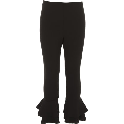 Girls black ruffle hem leggings