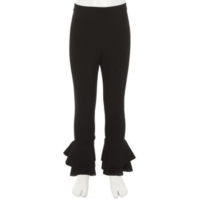 Girls black ruffle hem leggings