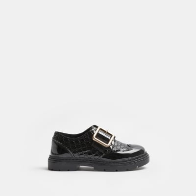 Girls black wide fit RI monogram buckle shoes River Island