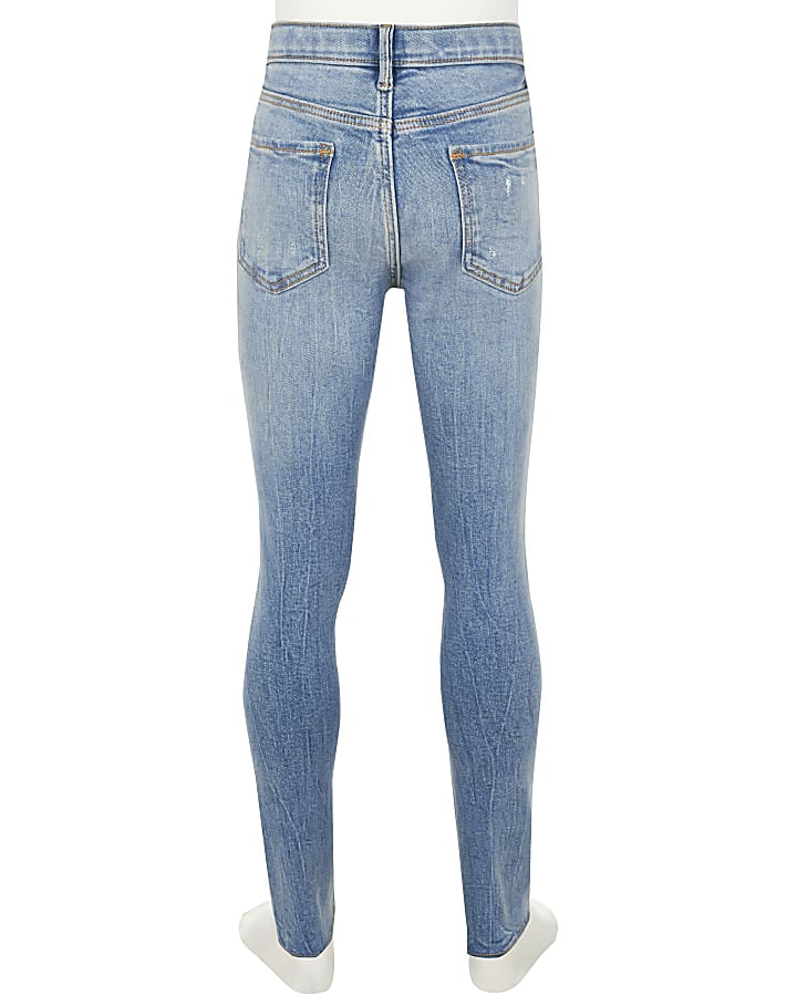 Girls blue ripped mid rise skinny jeans