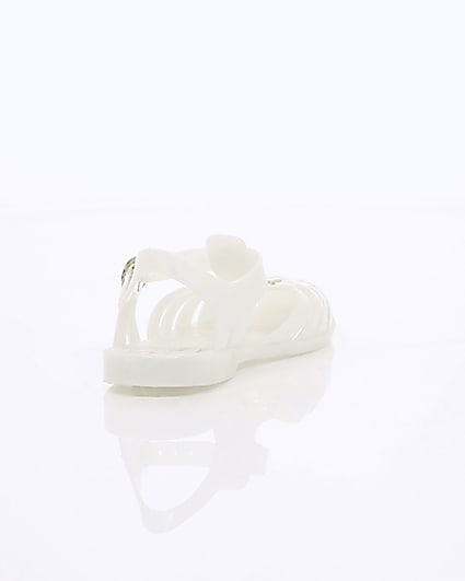 360 degree animation of product Girls cream caged jelly sandals frame-14