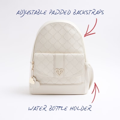 Girls cream embossed monogram backpack River Island