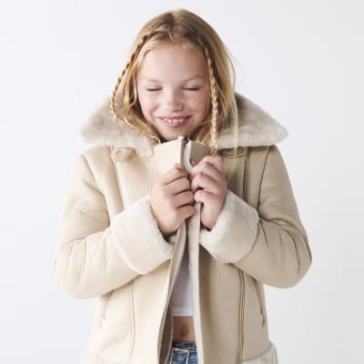 Girls cream faux fur aviator jacket River Island