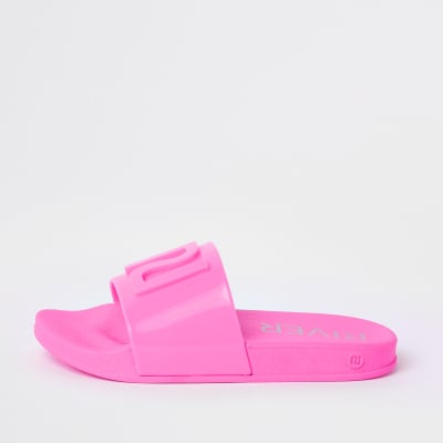 Girls neon pink RI jelly sliders | River Island