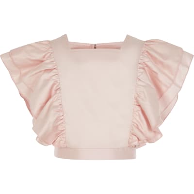 Girls pink ruffle front cropped top | River Island