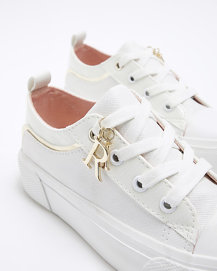 Girls white lace up charm detail trainers