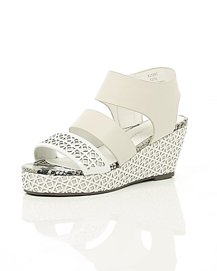 360 degree animation of product Girls white laser cut wedges frame-0