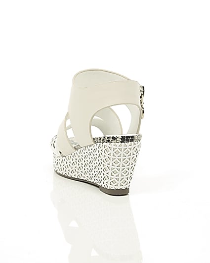 360 degree animation of product Girls white laser cut wedges frame-17