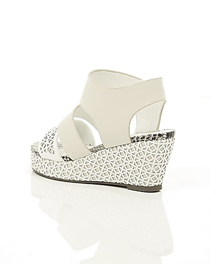 360 degree animation of product Girls white laser cut wedges frame-19