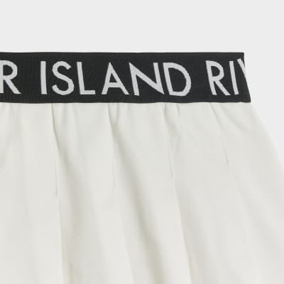 Girls white RI waistband pleated skirt River Island