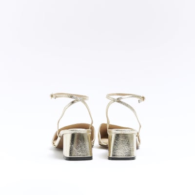 Gold block heeled court shoes