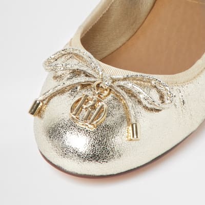 Gold bow ballerina shoes