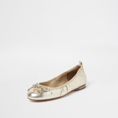 Gold bow ballerina shoes