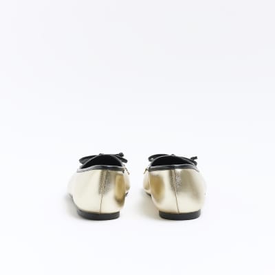 Gold bow ballet shoes