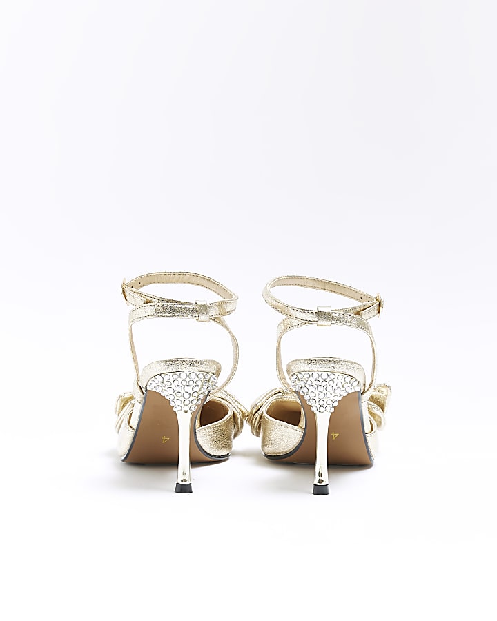 Gold bow heeled court shoes