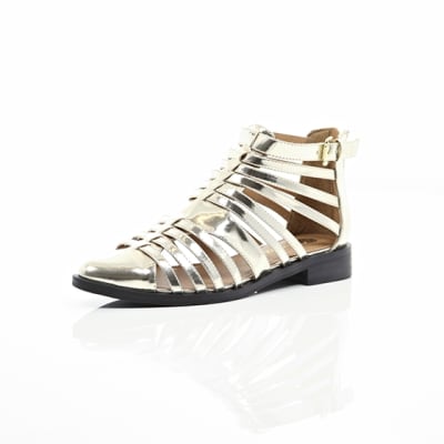 360 degree animation of product Gold closed toe gladiator sandals frame-0