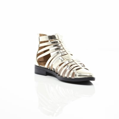 360 degree animation of product Gold closed toe gladiator sandals frame-6
