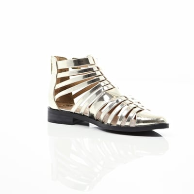 360 degree animation of product Gold closed toe gladiator sandals frame-7