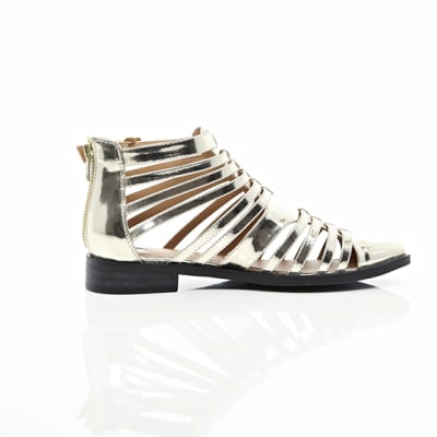 360 degree animation of product Gold closed toe gladiator sandals frame-10