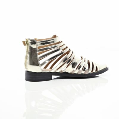 360 degree animation of product Gold closed toe gladiator sandals frame-11