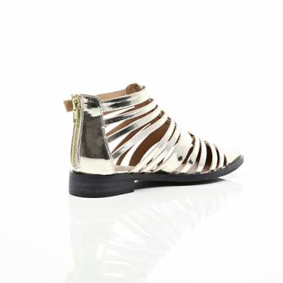 360 degree animation of product Gold closed toe gladiator sandals frame-12