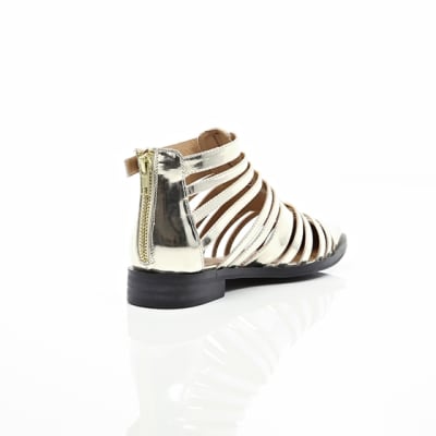 360 degree animation of product Gold closed toe gladiator sandals frame-13