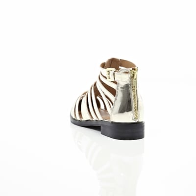 360 degree animation of product Gold closed toe gladiator sandals frame-17