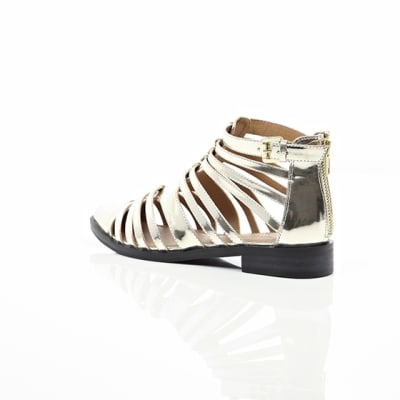 360 degree animation of product Gold closed toe gladiator sandals frame-19