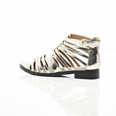 360 degree animation of product Gold closed toe gladiator sandals frame-20