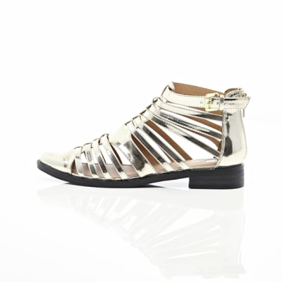 360 degree animation of product Gold closed toe gladiator sandals frame-21