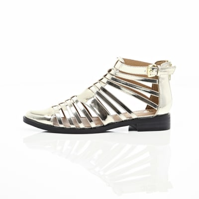 360 degree animation of product Gold closed toe gladiator sandals frame-22