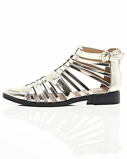360 degree animation of product Gold closed toe gladiator sandals frame-22