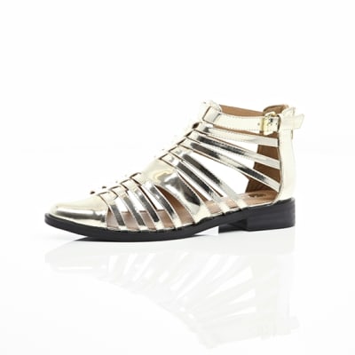 360 degree animation of product Gold closed toe gladiator sandals frame-23