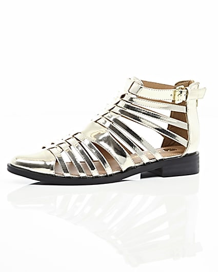 360 degree animation of product Gold closed toe gladiator sandals frame-23