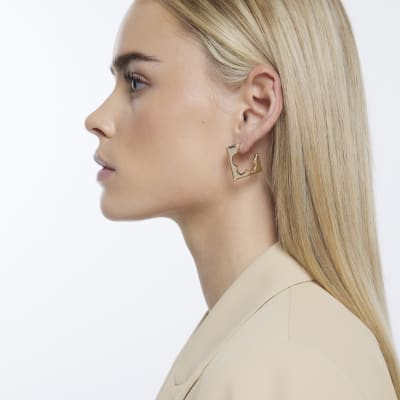 Gold cut out flower hoop earrings