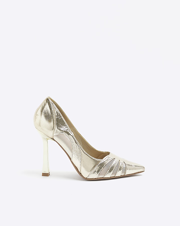 Gold cut out heeled court shoes
