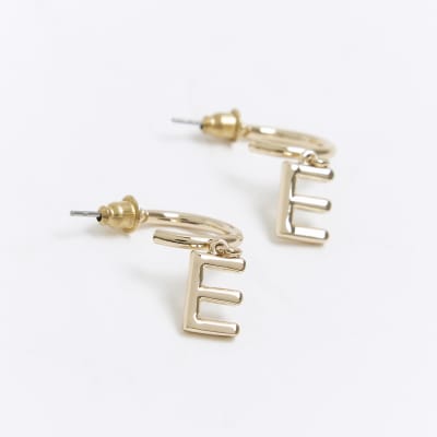 Gold E initial hoop earrings River Island