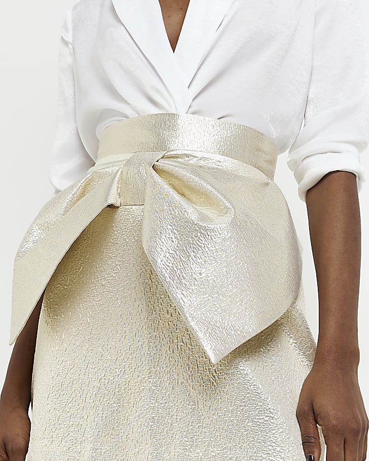 Gold jacquard bow mini skirt