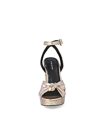 360 degree animation of product Gold knot front platform heeled sandal frame-21