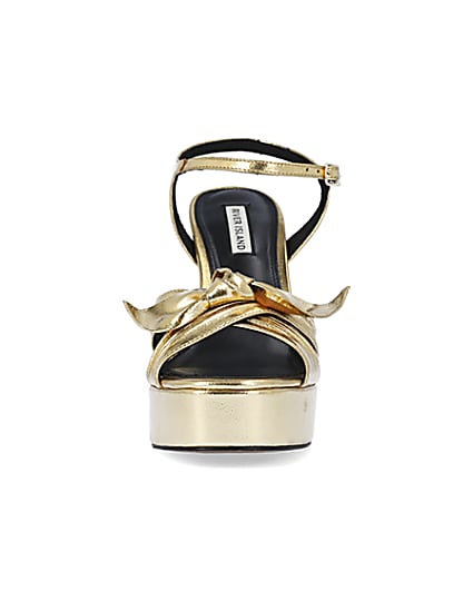 360 degree animation of product Gold knot platform heeled sandals frame-21