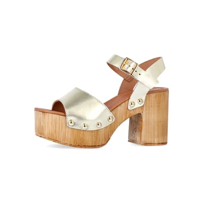 360 degree animation of product Gold leather heeled clogs frame-2