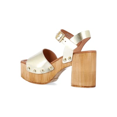 360 degree animation of product Gold leather heeled clogs frame-5