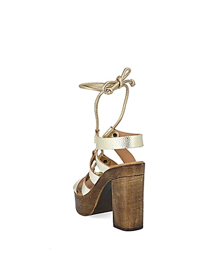 360 degree animation of product Gold leather tie up platform sandals frame-7