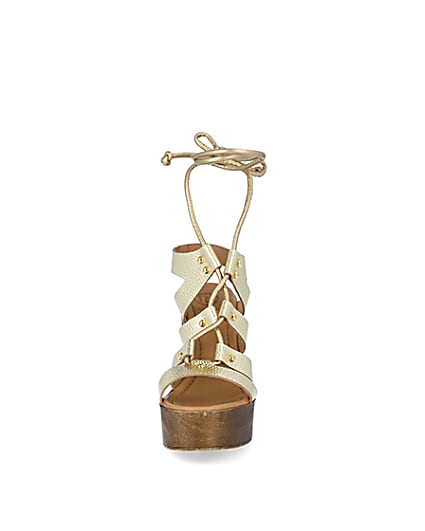 360 degree animation of product Gold leather tie up platform sandals frame-21