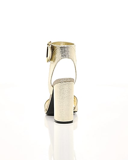 360 degree animation of product Gold metallic block heel sandals frame-16