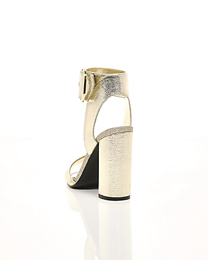 360 degree animation of product Gold metallic block heel sandals frame-17