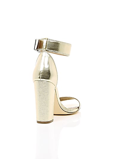 360 degree animation of product Gold metallic buckle block heel sandals frame-14